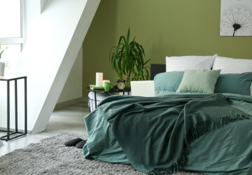 Bedroom with green walls, green bedding and green blanket