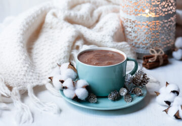 Hot chocolate, cosy blanket and candle
