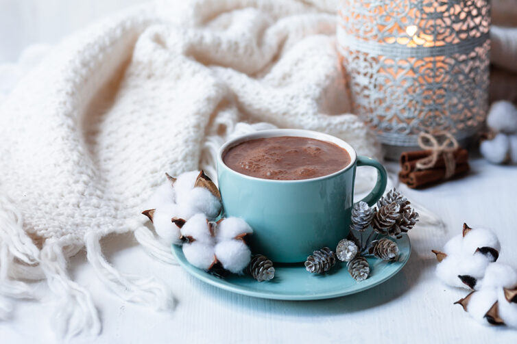 Hot chocolate, cosy blanket and candle