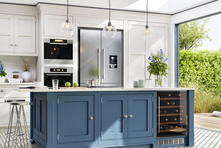 Blue and white kitchen cabinets in with built in cooker, American style fridge freezer and wine cooler cabinet