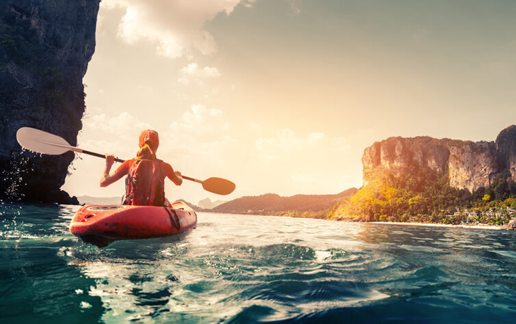 Women kayaking in sea