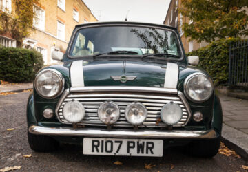 Car parked by the side of the road on a street with houses in London - Mini Mark VII