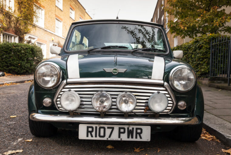 Car parked by the side of the road on a street with houses in London - Mini Mark VII