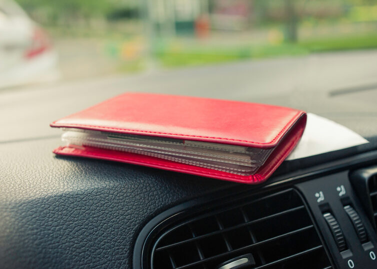 Red card wallet on car dashboards