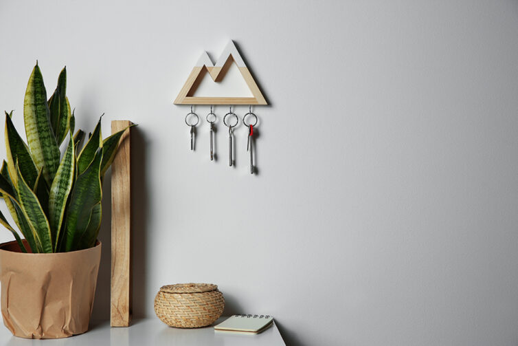 Wooden key holder shaped to look like two trianglular mountain peaks.