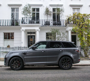 Range Rover outside white painted townhouse in London