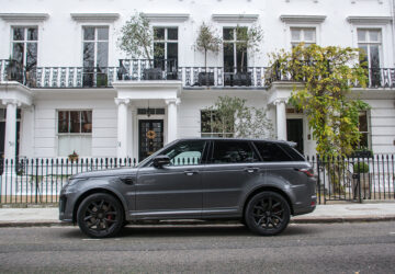 Range Rover outside white painted townhouse in London