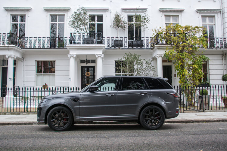 Range Rover outside white painted townhouse in London
