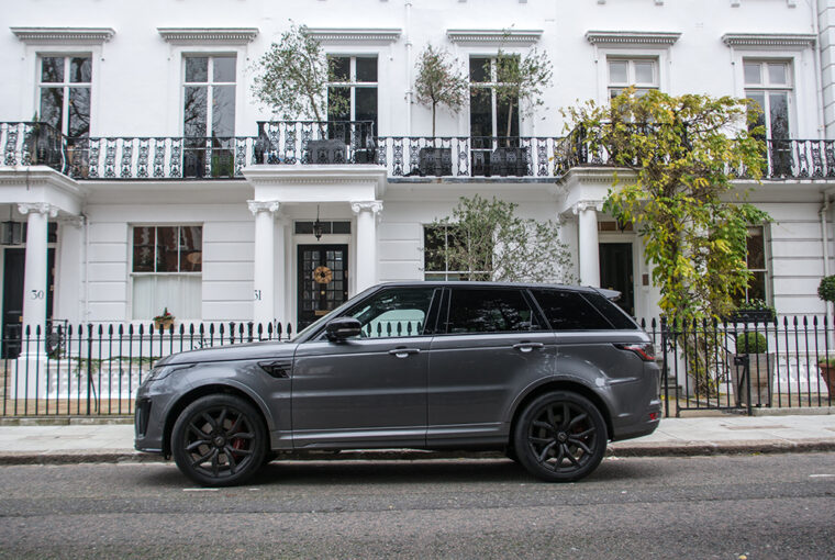 Range Rover outside white painted townhouse in London