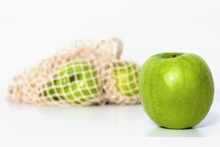 Green apples in eco mesh bag