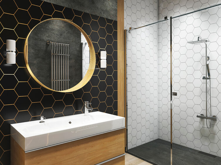 Modern bathroom with sink and walk in shower. Decorated with a large mittor and hexagonal geometric tiles in white and black