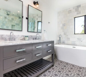 Grey and white modern bathroom with double sink, square bathroom mirrors and stand alone bath tub