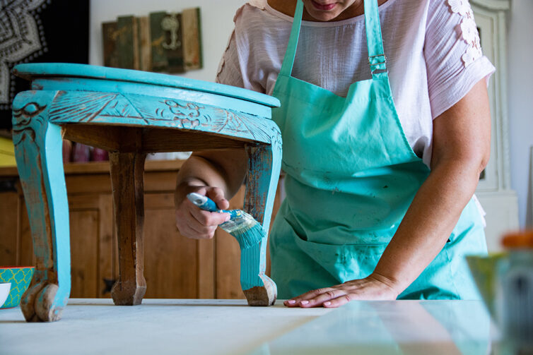 Upcycling furniture. Painting wooden furniture with blue paint