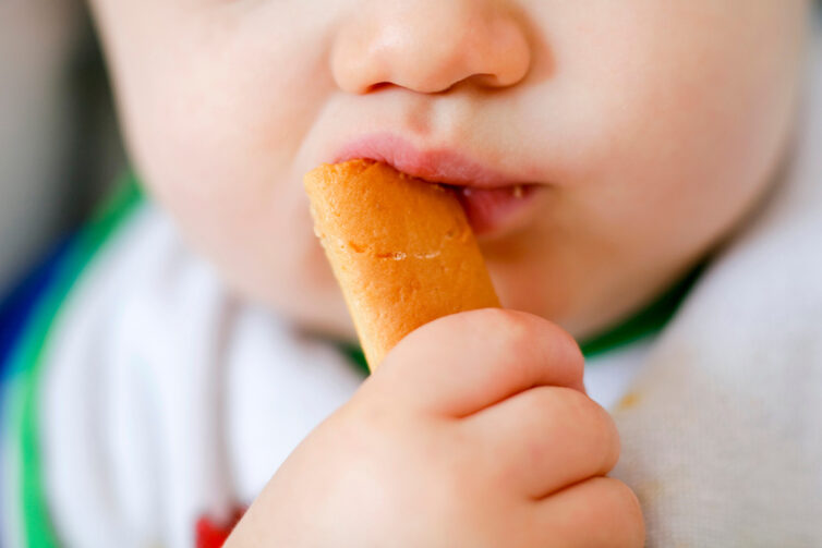 Baby eating snack