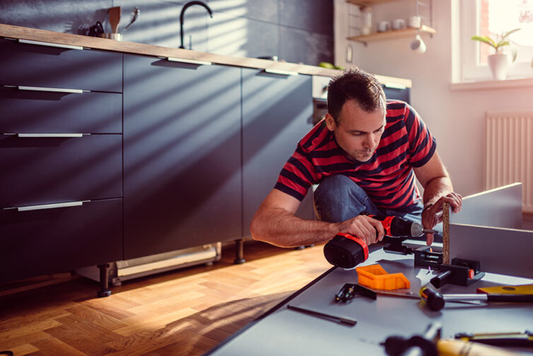 Man building kitchen cabinets