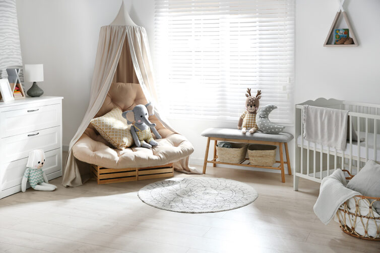 Babies bedroom with storage cupboard, large chair with canopy and bench storage