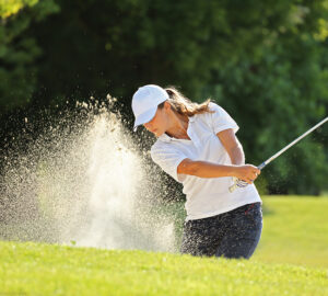 Women playing golf