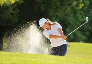 Women playing golf