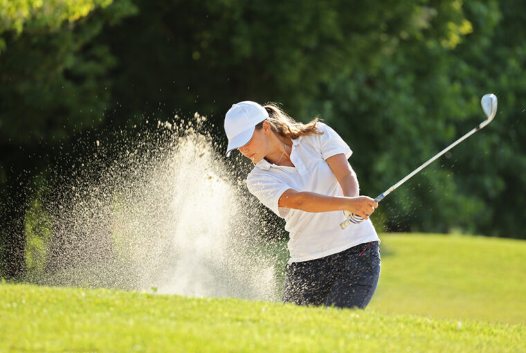 Women playing golf