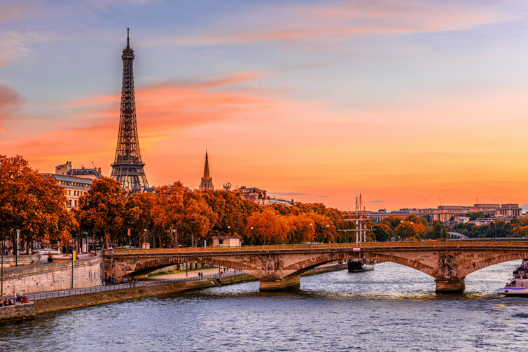 Seine river in Paris France, with sunset and Eiffel Tower during Autumn