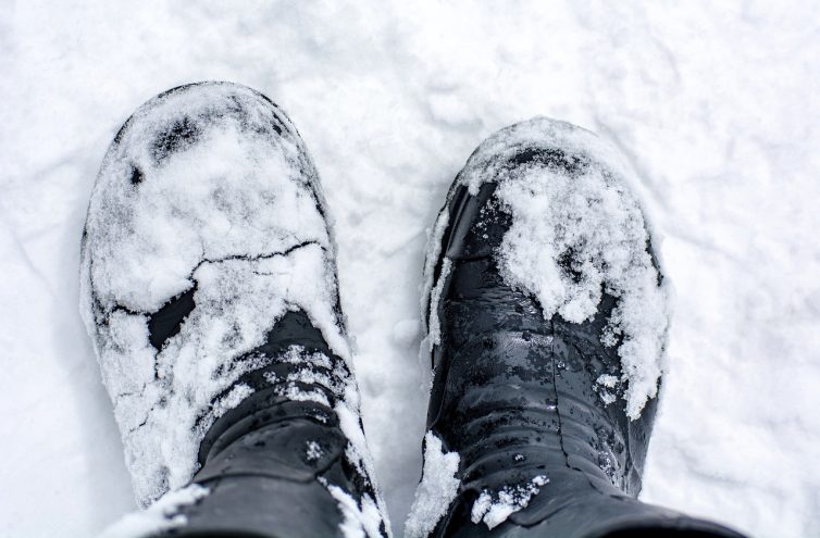 Black boots in the snow