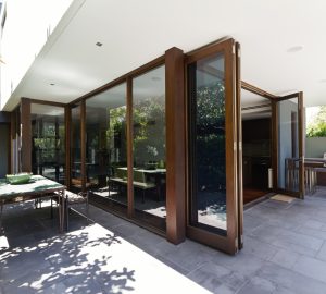 Modern open with large wooden bifolding doors