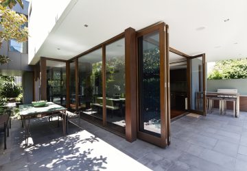 Modern open with large wooden bifolding doors