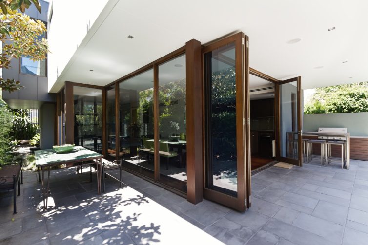 Modern open with large wooden bifolding doors