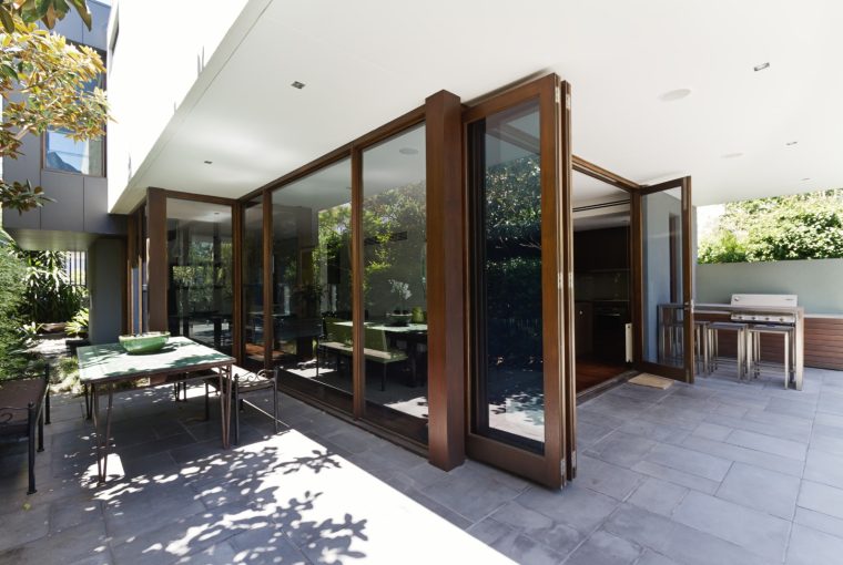 Modern open with large wooden bifolding doors