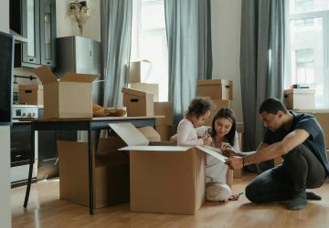 Family sat in a room with boxes