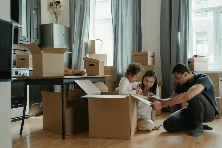 Family sat in a room with boxes