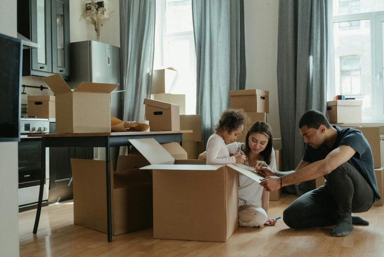 Family sat in a room with boxes