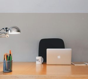 Work desk with silver apple laptop